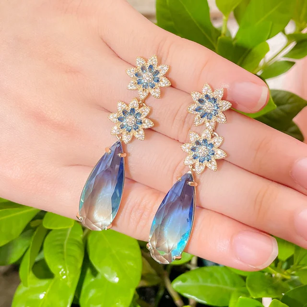 Blue flower dangling earrings