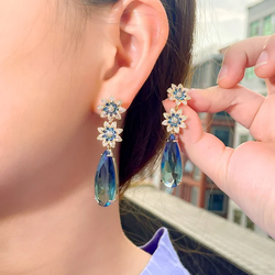 Blue flower dangling earrings